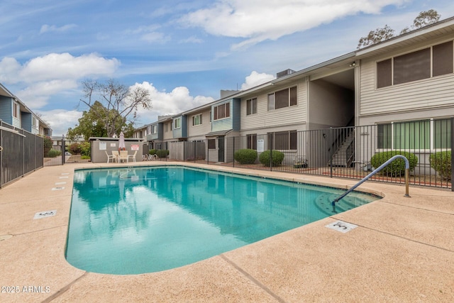 2608 W Berridge Ln Unit 220, Phoenix, AZ 85017 - community pool featuring a patio and a residential view