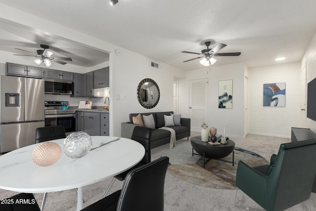 2608 W Berridge Ln Unit 220, Phoenix, AZ 85017 - dining area featuring ceiling fan, light carpet, and baseboards