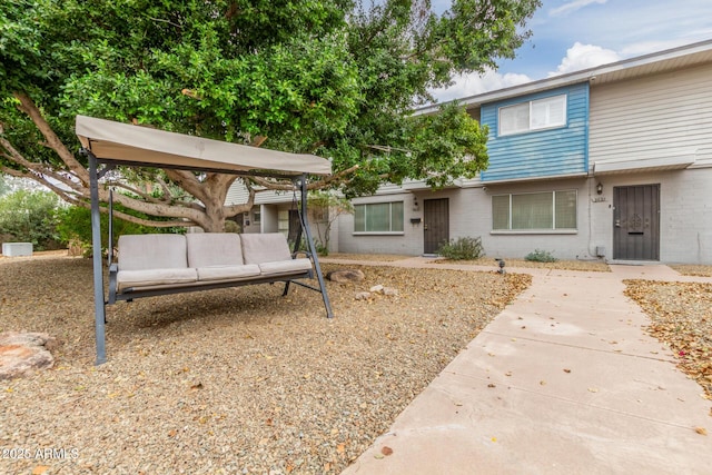 view of front of house with a patio area and outdoor lounge area