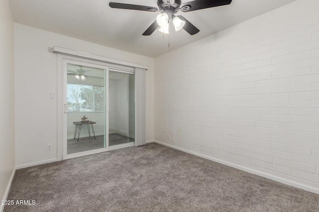 2608 W Berridge Ln Unit 220, Phoenix, AZ 85017 - unfurnished room with carpet floors, a ceiling fan, baseboards, and brick wall