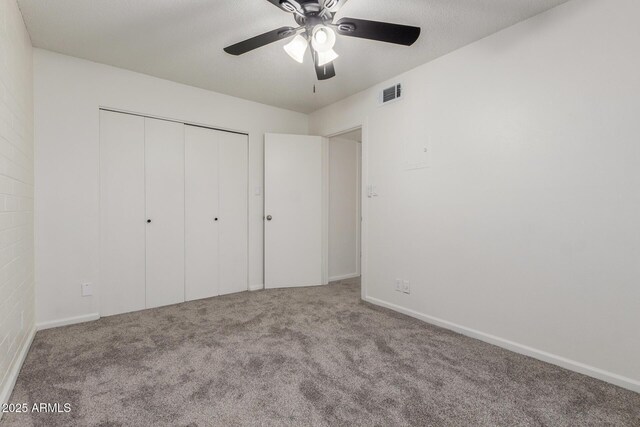 2608 W Berridge Ln Unit 220, Phoenix, AZ 85017 - unfurnished bedroom with carpet floors, a closet, and a ceiling fan