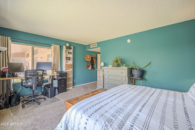 carpeted bedroom with a textured ceiling and visible vents