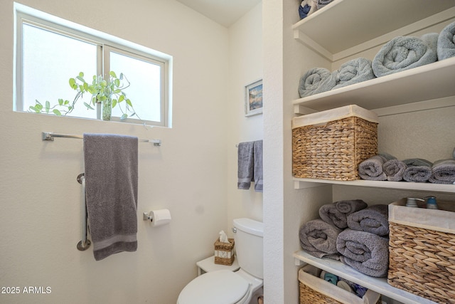bathroom featuring toilet
