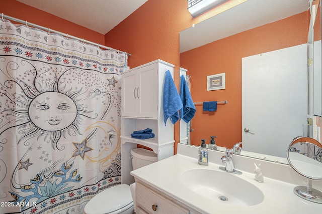 full bath featuring toilet, vanity, and curtained shower