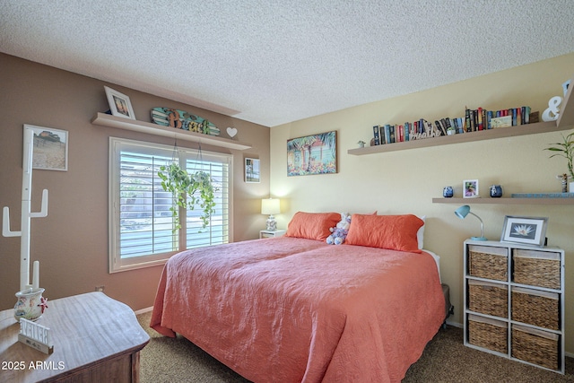 bedroom featuring a textured ceiling and carpet flooring