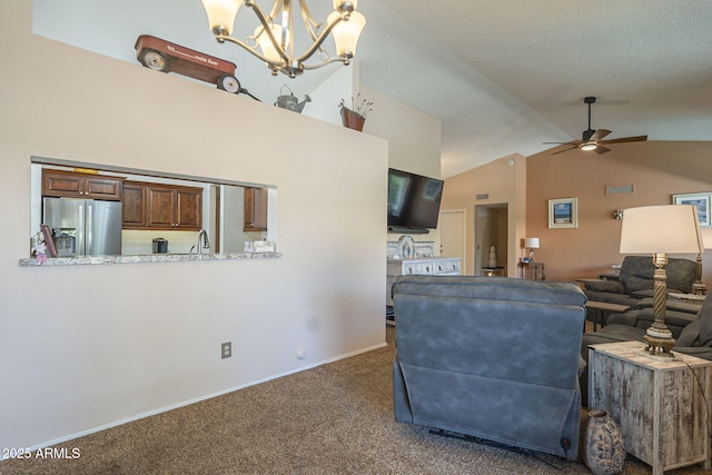 living room with dark carpet, high vaulted ceiling, baseboards, and ceiling fan with notable chandelier