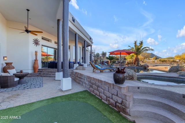 view of patio featuring ceiling fan