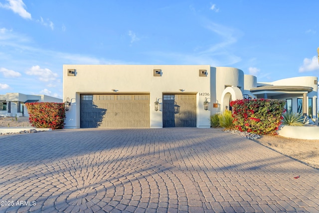 southwest-style home with a garage