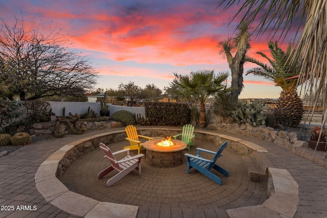 patio terrace at dusk with an outdoor fire pit