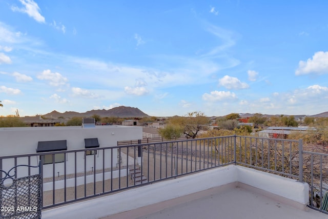 balcony featuring a mountain view