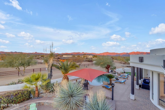 view of patio / terrace featuring a mountain view