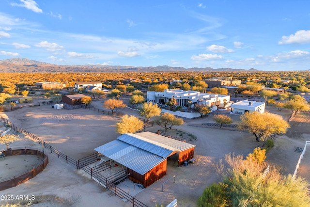 birds eye view of property featuring a mountain view