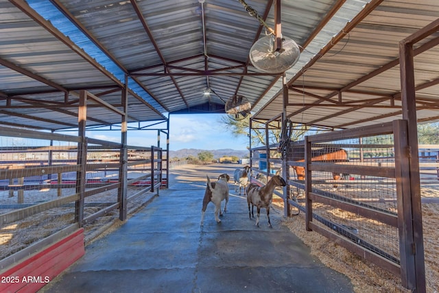 view of horse barn featuring a mountain view