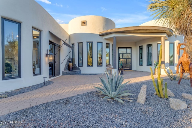 back of property featuring a patio