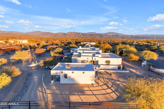 birds eye view of property with a mountain view