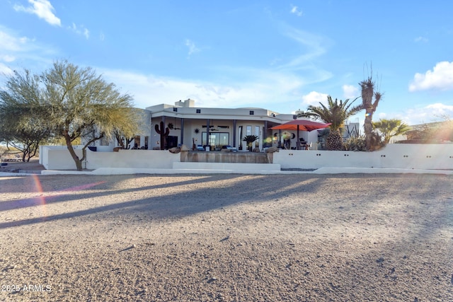 view of front of house with a garage and ceiling fan