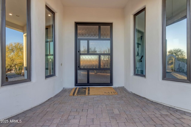 property entrance with a patio area