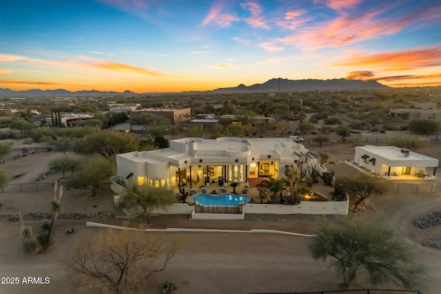 aerial view at dusk with a mountain view