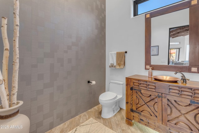 bathroom featuring vanity and toilet