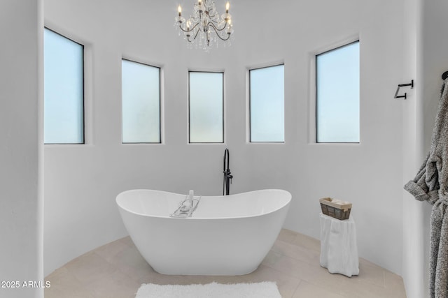 bathroom featuring tile patterned flooring and a bathtub