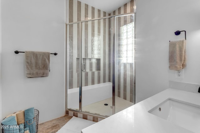 bathroom featuring vanity and an enclosed shower