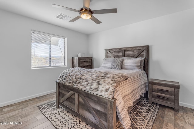 bedroom with hardwood / wood-style flooring and ceiling fan