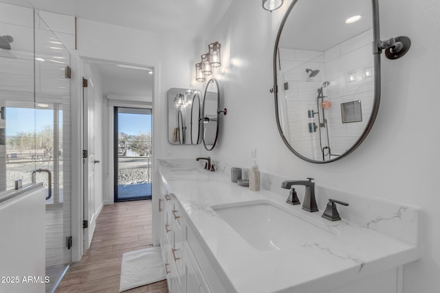 bathroom with vanity and an enclosed shower