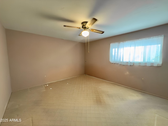 unfurnished room featuring a ceiling fan