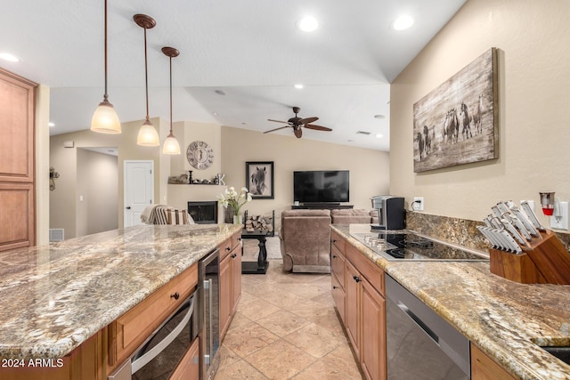 kitchen featuring pendant lighting, lofted ceiling, stainless steel dishwasher, ceiling fan, and light stone counters