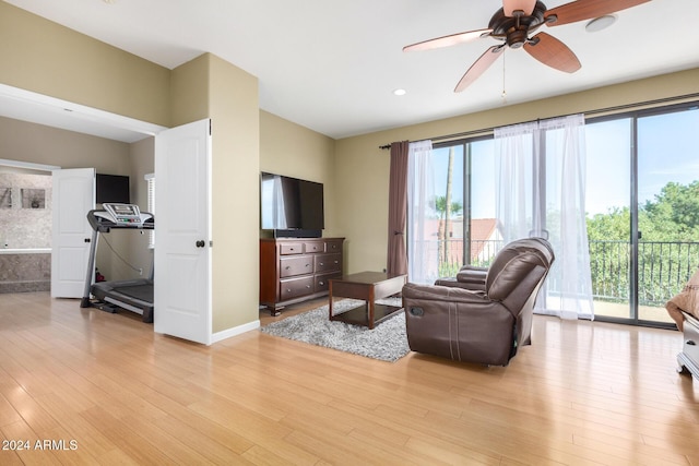 living room featuring ceiling fan, a healthy amount of sunlight, and light hardwood / wood-style floors