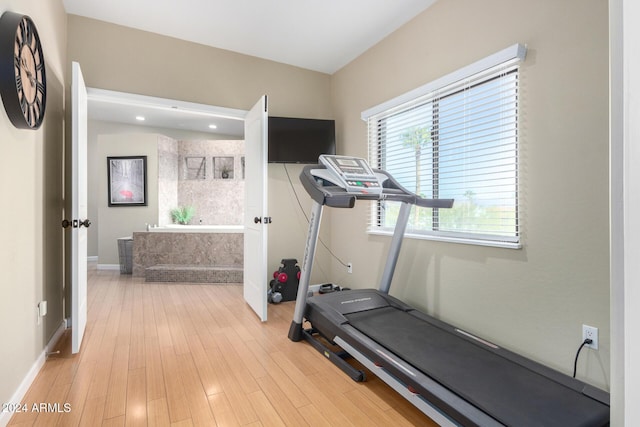 exercise area featuring light hardwood / wood-style flooring