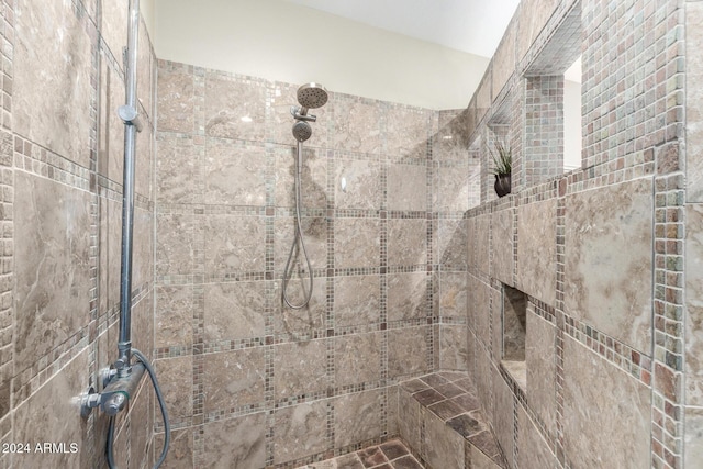 bathroom featuring tiled shower