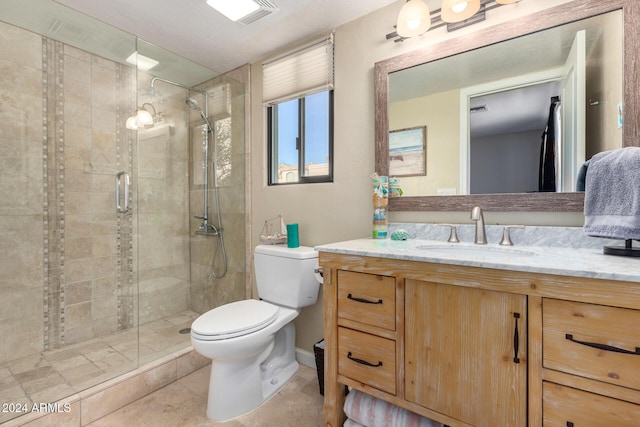 bathroom with tile patterned flooring, vanity, toilet, and an enclosed shower