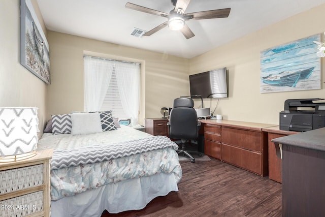 bedroom with dark hardwood / wood-style flooring and ceiling fan