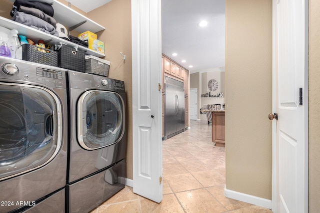 clothes washing area featuring independent washer and dryer