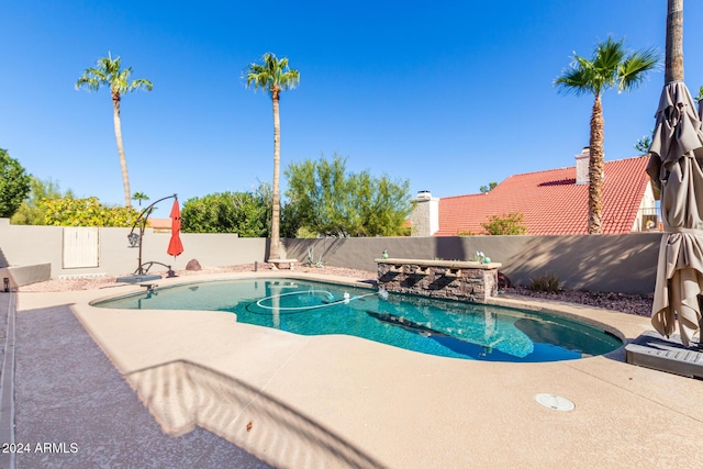 view of pool featuring a patio