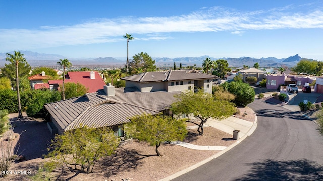 birds eye view of property featuring a mountain view