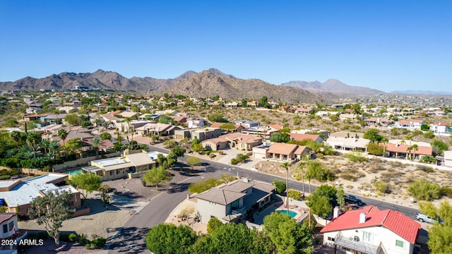 birds eye view of property with a mountain view