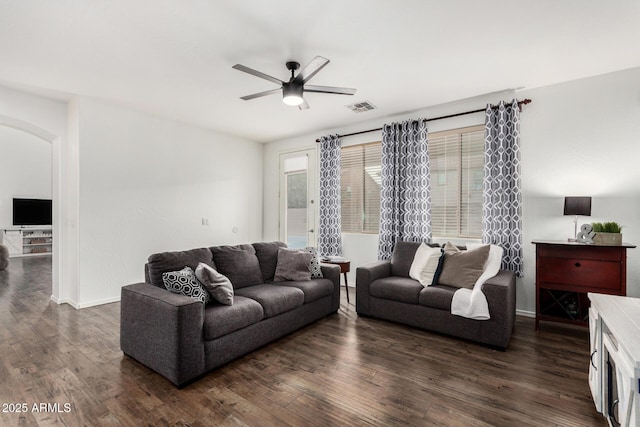 2986 E Country Shadows St, Gilbert, AZ 85298 - living area featuring ceiling fan, dark wood-style flooring, arched walkways, and baseboards