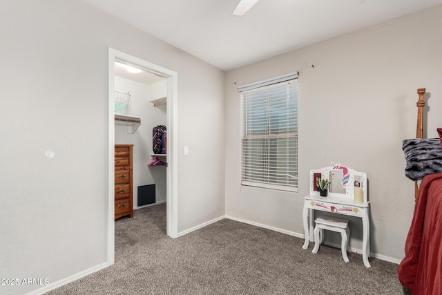 2986 E Country Shadows St, Gilbert, AZ 85298 - carpeted bedroom with a walk in closet, baseboards, a closet, and a ceiling fan