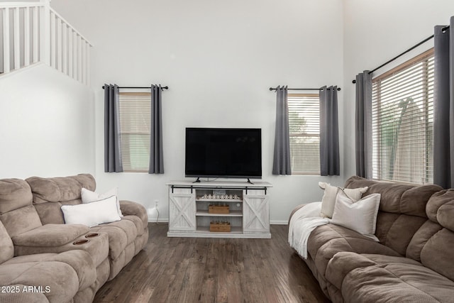 2986 E Country Shadows St, Gilbert, AZ 85298 - living area featuring a towering ceiling, dark wood-style floors, and baseboards