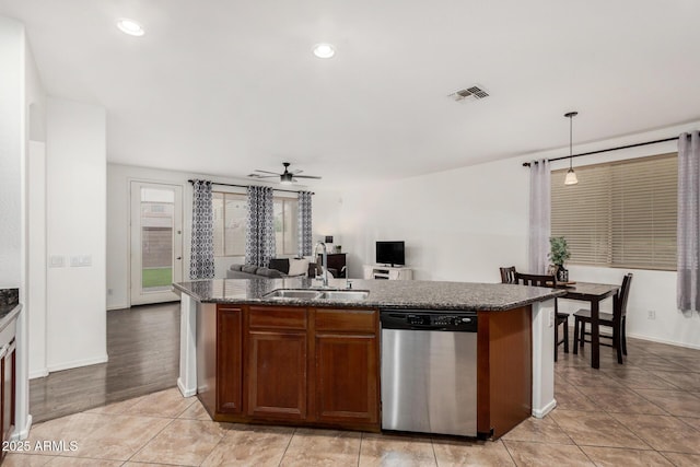 2986 E Country Shadows St, Gilbert, AZ 85298 - kitchen with stainless steel dishwasher, a sink, ceiling fan, a kitchen island with sink, and decorative light fixtures