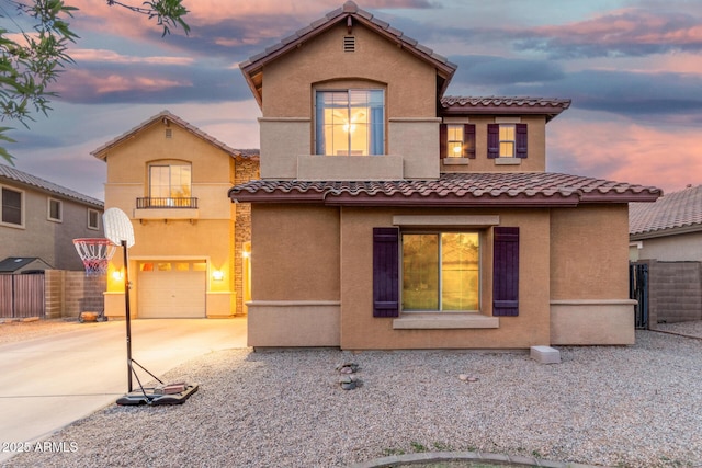 2986 E Country Shadows St, Gilbert, AZ 85298 - mediterranean / spanish-style home with a garage, driveway, stucco siding, a tile roof, and a balcony