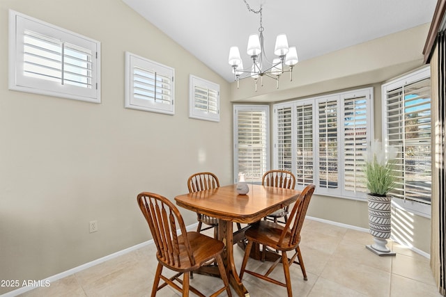 tiled dining room with vaulted ceiling and a chandelier