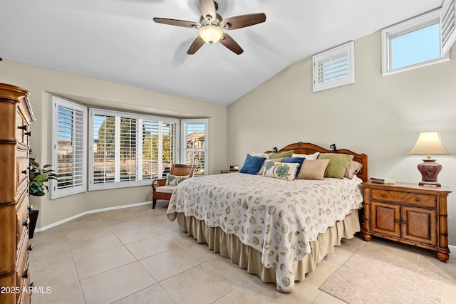 bedroom with ceiling fan, light tile patterned floors, and lofted ceiling