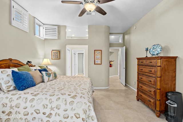 tiled bedroom featuring ceiling fan