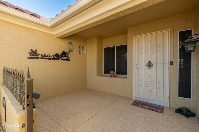 doorway to property featuring a patio