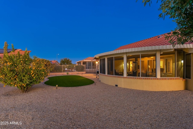 yard at dusk with a patio