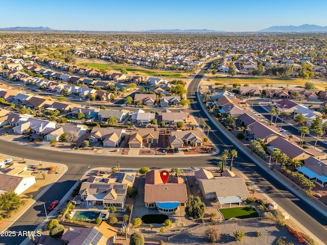 birds eye view of property with a mountain view