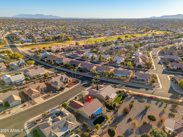 birds eye view of property featuring a mountain view